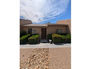 Charming single-story home with a well-maintained front yard and inviting entrance at 4238 Rollingstone Dr, Las Vegas, NV 89103