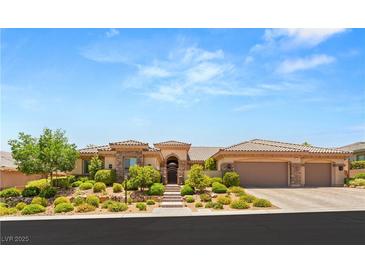 Stunning single-story home featuring a tile roof, manicured landscaping and a three car garage at 9747 Cathedral Pines Ave, Las Vegas, NV 89149