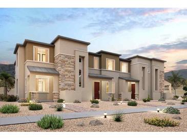 Charming two-story townhome featuring a modern design with a stone facade and desert landscaping at 197 Wewatta Ave, Henderson, NV 89011