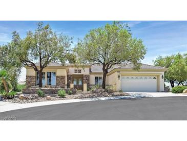 Charming single-story home featuring desert landscaping and a spacious three-car garage at 2899 Brook Trout Ct, Henderson, NV 89052