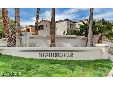 Charming Desert Shores Villas featuring lush landscaping, palm trees and stylish architecture at 3151 Soaring Gulls Dr # 1066, Las Vegas, NV 89128