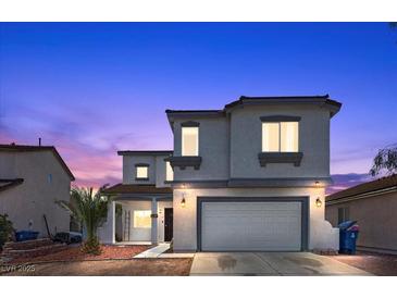 Charming two-story home with a well-maintained front yard and an attached two-car garage at 3871 Trellis View Ave, Las Vegas, NV 89115