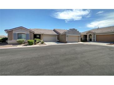 Charming single story home with a well maintained lawn and an attached two car garage at 4841 Raw Umber Ct, Las Vegas, NV 89131