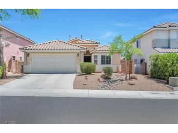 Inviting single-story home featuring a two-car garage, neutral paint scheme and desert landscaping at 5732 Hornbrook St, North Las Vegas, NV 89031
