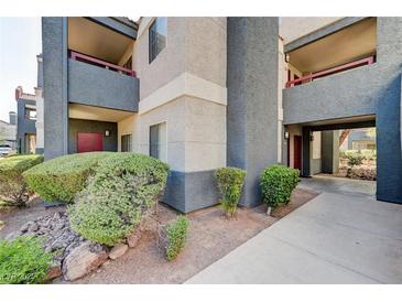 Attractive condo community featuring landscaping, covered parking, and neutral color scheme at 8600 W Charleston Blvd # 1059, Las Vegas, NV 89117