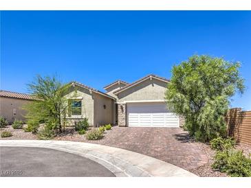 Charming single-story home with a well-manicured yard and a spacious two-car garage at 879 Klamath Springs St, Henderson, NV 89011