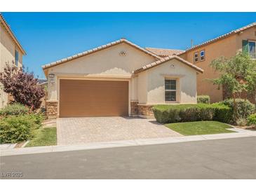 Charming single-story home featuring a two-car garage and a well-manicured front lawn at 12426 Mosticone Way, Las Vegas, NV 89141