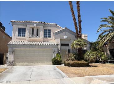 Charming two-story home features a neutral color palette, a two-car garage and desert landscaping at 3679 Funston Way, Las Vegas, NV 89129