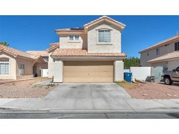 Charming two-story home featuring a neutral stucco exterior and a convenient two-car attached garage at 5612 Royal Castle Ln, Las Vegas, NV 89130