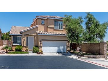 Charming two-story home featuring a well-maintained yard and a two-car garage at 10352 Natural Springs Ave, Las Vegas, NV 89129