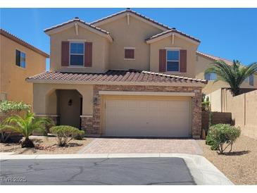 Charming two-story home with a tile roof and well-manicured landscaping showcasing curb appeal at 145 Forest Crossing Ct, Las Vegas, NV 89148
