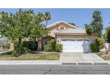 Charming single-story home with a well-maintained front yard and a two-car garage at 2528 Huber Heights Dr, Las Vegas, NV 89128