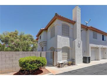 Charming two-story townhome featuring classic stucco and a terra cotta roofline in a quiet neighborhood at 278 Star Cluster Cir, Las Vegas, NV 89145