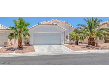 Charming single-story home with a well-maintained front yard and a two-car garage at 4420 Loma Ct, Las Vegas, NV 89130