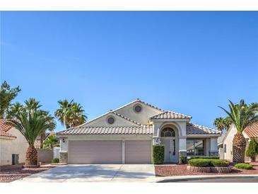 Charming single-story home with a tile roof, arched entryway, and a well-maintained front yard at 5425 Thomaston Ct, Las Vegas, NV 89122
