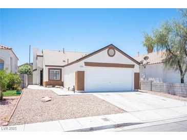 Charming single-story home with a well-maintained front yard, desert landscaping and a two car garage at 7231 Sequoia Springs Dr, Las Vegas, NV 89147