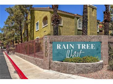 Inviting Rain Tree West condo complex with lush landscaping and warm exterior paint colors at 7950 W Flamingo Rd # 1024, Las Vegas, NV 89147