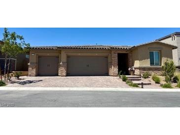 Charming single-story home featuring a three car garage and welcoming entryway at 10904 Ellis Pointe Ave, Las Vegas, NV 89166
