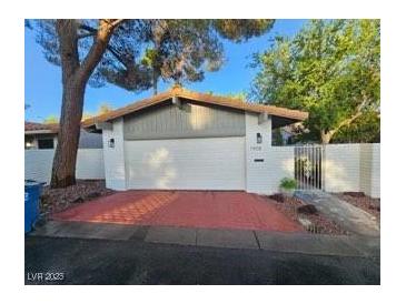 Charming single-story home featuring a brick driveway and a well-maintained front yard at 1905 Plaza Del Padre, Las Vegas, NV 89102