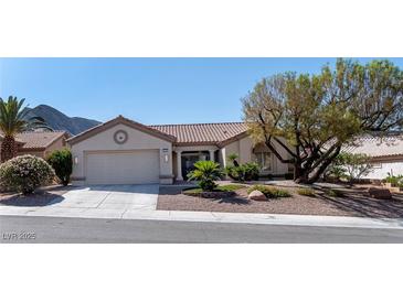 Charming single-story home featuring a well-manicured front yard and attached two-car garage at 2755 Darby Falls Dr, Las Vegas, NV 89134