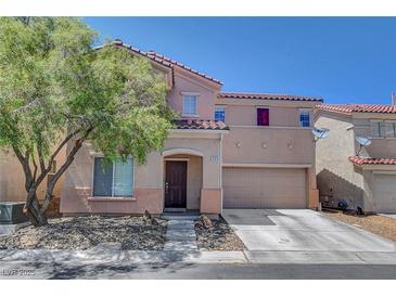 Charming two-story home featuring a two-car garage and well-maintained landscaping at 554 Haunts Walk Ave, Las Vegas, NV 89178