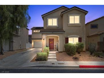 Charming two-story home featuring a well-maintained front yard, covered porch, and attached garage, perfect for Gathering living at 5656 Fast Payout Ct, Las Vegas, NV 89122