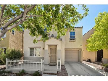 Charming two-story home featuring a covered front porch and a one-car garage at 7640 Woven Memories St, Las Vegas, NV 89149