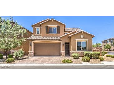 Inviting two-story home with a meticulously maintained front yard and attached two-car garage at 10961 Winter Rise St, Las Vegas, NV 89141