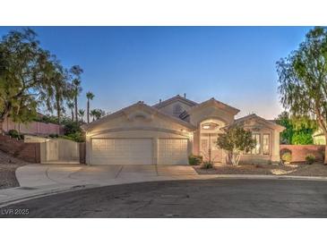 Inviting single-story home with a three-car garage and well-maintained landscaping at 1145 Glacier Park Ct, Henderson, NV 89052