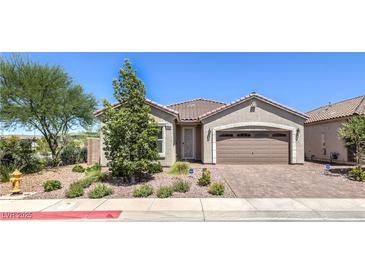Charming single-story home with a desert landscape, paver driveway, and a two car garage at 326 Zenith Crest St, Henderson, NV 89015