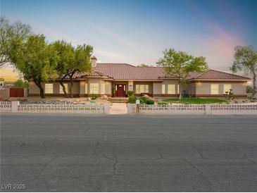 Charming single-story home featuring a tile roof and well-maintained front yard at 5340 N Campbell Rd, Las Vegas, NV 89149