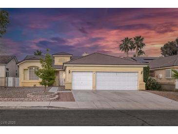 Charming single-story home featuring a desert-landscaped yard, and a spacious two-car garage at 5512 Goldbrush St, Las Vegas, NV 89130
