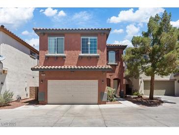 Charming two-story home with a two-car garage and well-maintained landscaping on a sunny day at 10918 Avenzano St, Las Vegas, NV 89141
