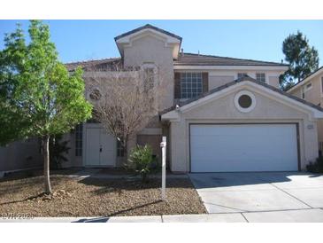 Charming two-story home featuring a two-car garage and a well-maintained front yard at 254 Horizon Pointe Cir, Henderson, NV 89012