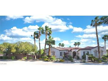 Charming single-story home with beautiful landscaping, lush trees, and a tile roof at 3540 Wisdom Ct, Las Vegas, NV 89120