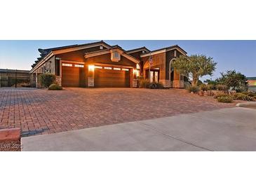Charming single-story home featuring a brick driveway and a well-manicured front yard at 6208 W Rome Blvd, Las Vegas, NV 89131