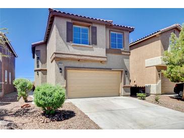 Two story home with a two car garage and desert landscaping at 6346 Azurelyn Ave, Las Vegas, NV 89122