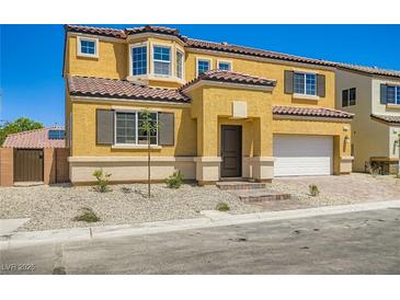 Inviting yellow two-story home featuring a tile roof, charming brick walkway, and attached two-car garage at 9712 Rocket Grove Ct, Las Vegas, NV 89178