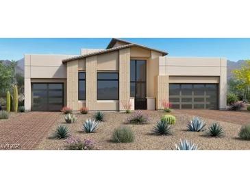 Contemporary home boasts clean lines, desert landscaping, and a two-car garage at 10809 Agate Cliffs Ave, Las Vegas, NV 89135
