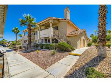 Charming multi-Gathering home with well-maintained landscaping, desert rock, and mature palm trees at 1104 Pinto Rock Ln # 101, Las Vegas, NV 89128