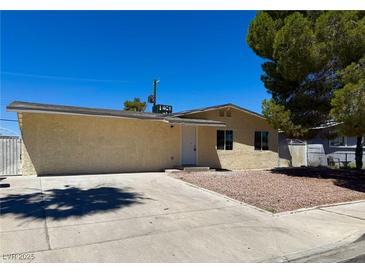 Charming single-story home featuring a well-maintained exterior and a neatly landscaped front yard at 236 Pershing Dr, Las Vegas, NV 89107