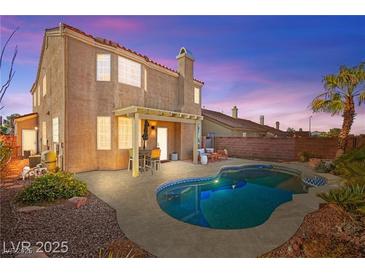 A refreshing backyard pool and patio area with a pergola, perfect for outdoor relaxation and entertaining guests at 262 Cielito Lindo St, Henderson, NV 89012