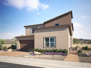 A modern two-story home features a two car garage, desert landscaping, and a private entrance gate at 297 Stradella Pl, Henderson, NV 89015