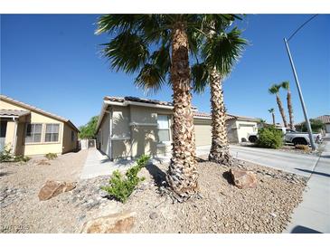 Charming single-story home with desert landscaping and a two-car garage at 6040 Eganridge Ct, North Las Vegas, NV 89081