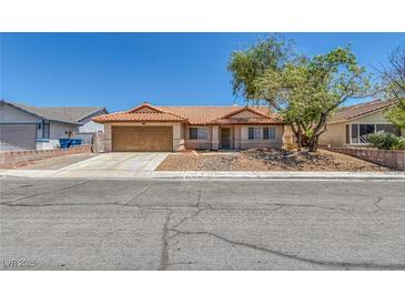 Charming single-story home with a well-maintained front yard and a two-car garage at 6112 Blossom Knoll Ave, Las Vegas, NV 89108