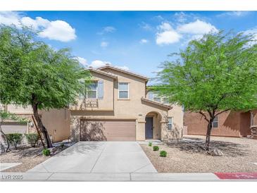 Charming home with two-car garage, low maintenance landscaping, and beautiful curb appeal at 10045 Natchez Trace St, Las Vegas, NV 89178