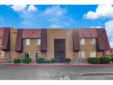 Charming two-story condo featuring unique architectural details and well-maintained landscaping at 5200 Indian River Dr # 301, Las Vegas, NV 89103