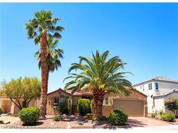 Inviting single-story home with mature palm trees and well-maintained desert landscaping in a desirable neighborhood at 5929 Gentle Creek Ln, North Las Vegas, NV 89031