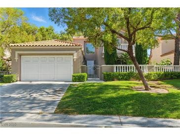 Charming two-story home showcasing a well-manicured lawn and an attached two-car garage at 8215 Crow Valley Ln, Las Vegas, NV 89113