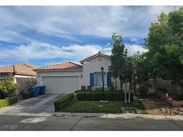 Charming single-story home with a well-maintained front yard, and a two car garage at 8277 Orange Vale Ave, Las Vegas, NV 89131